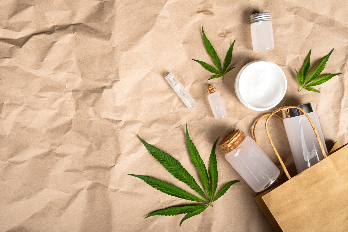 Cannabis Cosmetic Products on Brown Paper Background